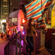 A woman walks past a small temple in the Central district of Hong Kong on April 29, 2021